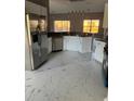 Spacious kitchen featuring stainless steel appliances and marble flooring at 130 Prima Dr, Kissimmee, FL 34759