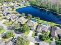 Community overview, featuring lakefront homes and pool at 1221 Harwick Ln, Ormond Beach, FL 32174