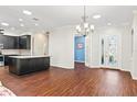 Kitchen and dining area with hardwood floors and a chandelier at 1311 Hansberry Ln, Ormond Beach, FL 32174