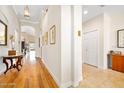 Bright and spacious entryway with hardwood floors and decorative furniture at 3189 Connemara Dr, Ormond Beach, FL 32174