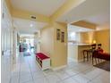 Bright and spacious condo entryway with bench at 4670 Links Village Dr # B201, Ponce Inlet, FL 32127