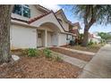 Front view of townhome showcasing landscaping and sidewalk at 3548 Forest Branch Dr # C, Port Orange, FL 32129