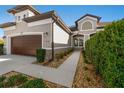 Two-story house with walkway, landscaping, and brown garage door at 1510 Kinnard Cir, Ormond Beach, FL 32174