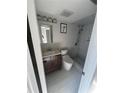 Modern bathroom features sleek vanity, toilet, and tiled shower at 5500 Ocean Shore Blvd # Ut61, Ormond Beach, FL 32176