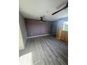 Bright bedroom featuring wood-look floors and ceiling fan at 5500 Ocean Shore Blvd # Ut61, Ormond Beach, FL 32176