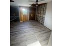 Bright bedroom featuring wood-look floors and block wall at 5500 Ocean Shore Blvd # Ut61, Ormond Beach, FL 32176