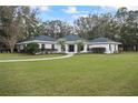 Charming single-story house with manicured lawn and landscaping enhancing curb appeal at 7024 Sw 93Rd Street Rd, Ocala, FL 34476