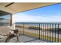 Oceanfront balcony with chair, offering stunning ocean views at 3100 Ocean Shore Blvd # 5020, Ormond Beach, FL 32176