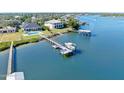 Aerial of waterfront home with private dock and boat at 59 Cunningham Dr, New Smyrna Beach, FL 32168