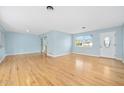 Bright living room featuring hardwood floors and light blue walls at 142 Seton Trl, Ormond Beach, FL 32176