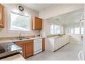 Efficient kitchen with wood cabinets, stainless steel appliances, and ample counter space at 67 Ormond Shores Dr, Ormond Beach, FL 32176