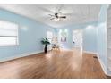 Light and airy living room with hardwood floors and a ceiling fan at 67 Ormond Shores Dr, Ormond Beach, FL 32176