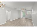 Bright and airy living room with light gray walls and tile flooring at 825 Magnolia Ave, Holly Hill, FL 32117