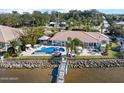 Luxury waterfront home showcasing a private pool and dock at 1778 John Anderson Dr, Ormond Beach, FL 32176