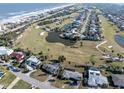 Aerial view showcasing the property's location near the ocean and golf course at 200 Country Club Dr, Ormond Beach, FL 32176