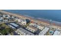 Aerial view of oceanfront property showing its location and beach access at 2850 Ocean Shore Blvd # 8, Ormond Beach, FL 32176