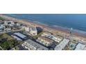 Aerial view showing oceanfront property and its proximity to the beach at 2850 Ocean Shore Blvd # 8, Ormond Beach, FL 32176