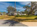 Ranch-style home with a spacious yard and mature trees at 105 Park Cir, Daytona Beach, FL 32117