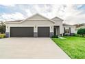Charming one-story home with a three car garage and beautiful stone accents at 3142 Silvermines Ave, Ormond Beach, FL 32174