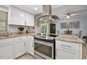 Modern kitchen with stainless steel appliances and granite countertops at 41 Laurel Oaks Cir, Ormond Beach, FL 32174