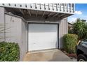 Attached garage with white door at 135 Lagoon Ct, New Smyrna Beach, FL 32169