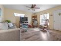 Cozy living room with wood-look flooring and a comfortable seating arrangement at 5 Alamanda Dr, Ormond Beach, FL 32176