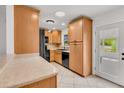 Bright kitchen featuring lots of cabinet space, stainless steel appliances, and a tiled floor at 6680 Se 174Th Ln, Summerfield, FL 34491