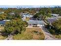 Aerial view of a cozy home with a well-manicured lawn in a tranquil neighborhood with city skyline views at 1705 Cordova Ave, Daytona Beach, FL 32117