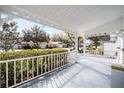 Relaxing front porch showcasing the neighborhood's curb appeal and serene surroundings at 8885 Sw 95Th St # C, Ocala, FL 34481