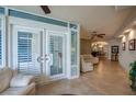 Bright living room with floor to ceiling windows and tile flooring at 4555 S Atlantic Ave # 4508, Port Orange, FL 32127