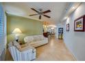 Open living room with easy access to the bar, dining room, and sun room at 4555 S Atlantic Ave # 4508, Port Orange, FL 32127