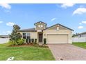 Charming single-Gathering home boasts manicured landscaping and inviting curb appeal with brick-paver driveway at 806 Armenia Ct, New Smyrna Beach, FL 32168