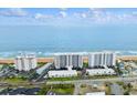 Aerial view of beachfront condominiums, blue ocean waters, and surrounding landscape at 1155 Ocean Shore Blvd # 507, Ormond Beach, FL 32176