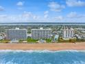 Beachfront condo buildings with ocean views, landscaping, and direct beach access at 1155 Ocean Shore Blvd # 507, Ormond Beach, FL 32176