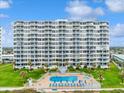 Luxury beachfront condos with an outdoor pool, a landscaped yard, and ocean view at 1155 Ocean Shore Blvd # 507, Ormond Beach, FL 32176