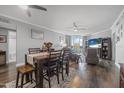 Inviting living room with a dining area featuring hardwood floors, ceiling fans, and ocean views at 231 Riverside Dr # 1907-1, Holly Hill, FL 32117