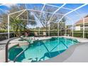 Screened-in pool area with a spa, perfect for relaxation and outdoor enjoyment at 5 Captiva At Lionspaw, Daytona Beach, FL 32124