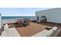 An expansive rooftop deck offers ocean views and a relaxing seating area at 3390 Ocean Shore Blvd # 4020, Ormond Beach, FL 32176
