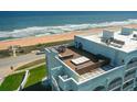 This home features a rooftop deck with ocean views and outdoor furniture at 3390 Ocean Shore Blvd # 4020, Ormond Beach, FL 32176