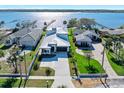 Stunning aerial view of the home featuring a metal roof with the ocean in the background at 2244 S Halifax Dr, Daytona Beach, FL 32118