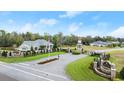 Liberty Village community entrance showcasing the gate, signage, landscaping, and a charming lighthouse structure at 2337 Legacy Ln, New Smyrna Beach, FL 32168