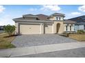 Charming exterior view highlighting its well-maintained lawn and three-car garage at 525 Mosaic Blvd, Daytona Beach, FL 32124