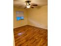 Cozy bedroom with a ceiling fan and window for natural light at 10891 Sw 86Th Ave, Ocala, FL 34481