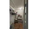 Walk-in closet providing ample storage with shelving and hanging space at 105 Cattail Ct, Kissimmee, FL 34743
