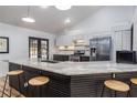Modern kitchen featuring an island with seating, stainless steel appliances, and ample counter space at 1060 Still Rd, Pierson, FL 32180