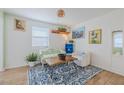 Bright living room with wood floors, a stylish rug, and comfortable seating at 151 Holland Rd, Ormond Beach, FL 32176