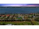 Captivating aerial view of luxury homes situated along the waterfront, showcasing the community and boat docks at 2924 River Point Dr, Daytona Beach, FL 32118