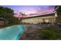 Beautiful backyard oasis featuring a sparkling pool, spa, and ample patio space for relaxation and entertaining at 2924 River Point Dr, Daytona Beach, FL 32118