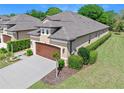 Beautiful home with a two-car garage, green lawn, and well-maintained landscaping at 3205 Bailey Ann Dr, Ormond Beach, FL 32174