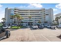 Beautiful exterior view of a condo complex, showcasing ample parking and a grand entrance at 4631 S Atlantic Ave # 8706, Ponce Inlet, FL 32127